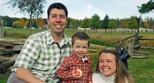 cropped farm guy with wife kid
