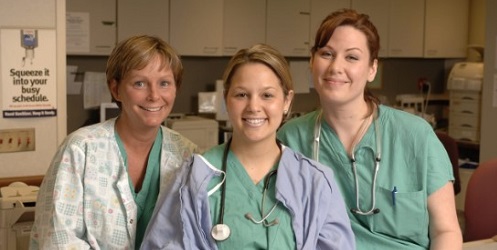 cropped nurses in green